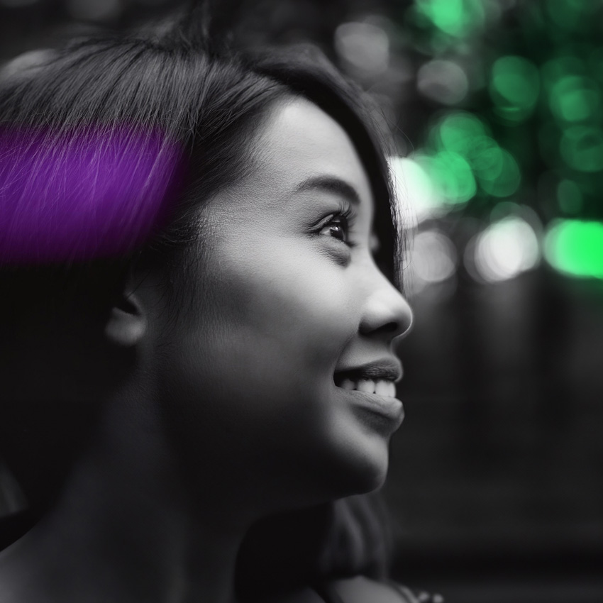 Portrait of women with purple light reflecting on her hair