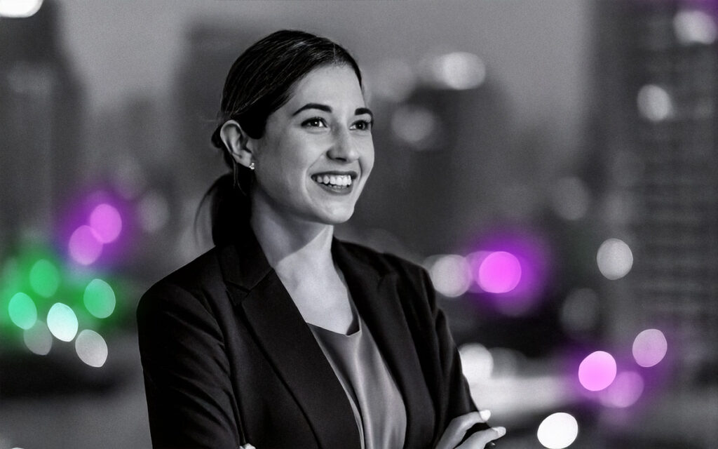 Smartly dressed corporate woman with business district in the background