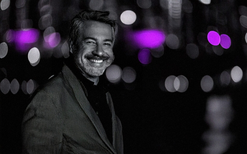 Portrait of charismatic older man photographed on a blurred background